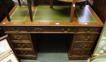 A modern leather topped twin pedestal desk