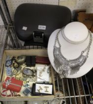 A selection of costume jewellery with a necklace on stand and a locking make-up box