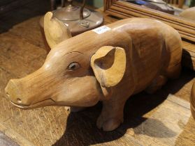 A substantial wooden carved pig