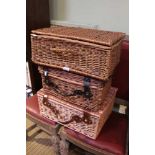 Three empty wicker picnic baskets