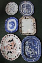 A collection of 6 pottery meat platters