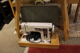An electric sewing machine by Central in original carry case
