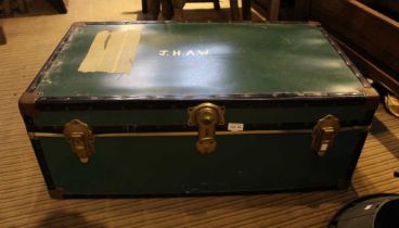 A vintage green travel trunk