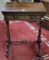A 19th century rosewood needlework table, the hinged cover opens and rotates to reveal a chess board