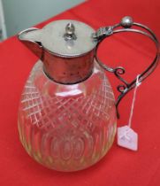 A silver mounted cut glass claret jug, having hinged cover and wire handle, hallmarks worn