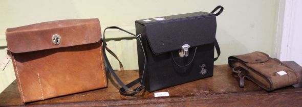 A pair of Tasco binoculars in case with a Prinzlux pair of binoculars with a folding Box Brownie