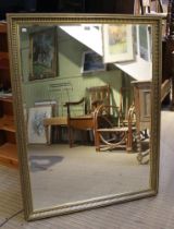 A large bevel edged gilt framed wall mirror