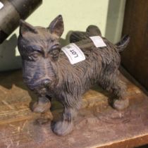 A vintage cast metal model of a Scotty Dog