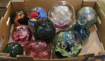 A collection of ten decorative glass paperweights