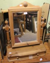 A pine swing mirror with single drawer beneath