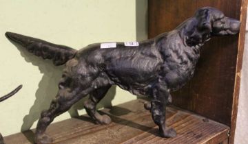 A cast metal model of a gun dog