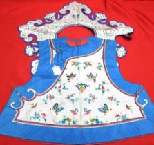 A blue bordered embroidered waistcoat, and separate collar