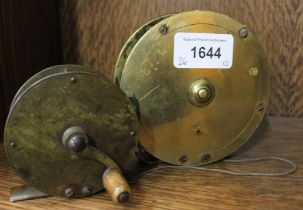 Two vintage fishing reels: Early 2 3/4" crank handle, polished wooden handle in original condition