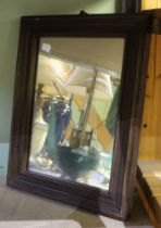 A small Victorian oak framed wall mirror
