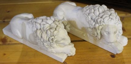 Two modern white desk top lions