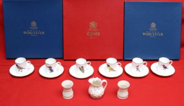 A set of six Rowland Ward design coffee cans and saucers by Hammersley, together with three cake pla