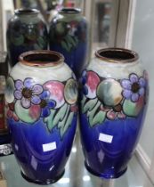 A pair of Doulton stoneware Vases with floral glazed decoration