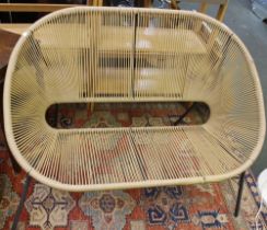 A two seater metal framed garden/conservatory chair with woven plastic seat pad and back