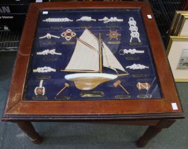 A Glass Topped Display Table containing examples of Sailing Knots