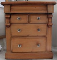 An old pine small chest of drawers with later glass handles