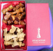 A complete boxed set of Staunton chess pieces