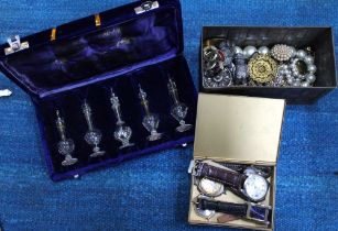 A box containing costume jewellery, a box of watches and a boxed set of Indian perfume bottles
