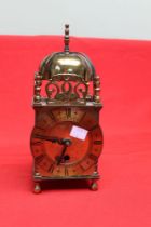 A Smiths brass cased reproduction lantern clock with pierced and engraved decoration, 10.5cm dial wi