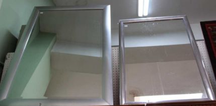 Two silver framed wall mirrors