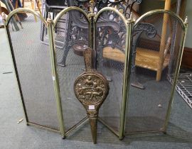 A folding brass spark guard with a set of brass bellows