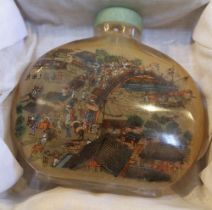 A large glass Chinese inside painted snuff bottle, depicting busy village scene, & bridge over river