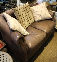 Modern Leather two seater sofa together with two leather armchairs