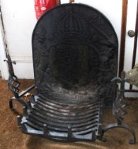 A 19th century fire grate with solid fire back