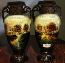 A pair of pottery vases, hand painted landscape decoration