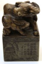 A Chinese stoneware chop/seal for year of the Ox with carved buffalo & calf