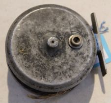 A vintage 3 " un-marked fly reel with old line and rear plate