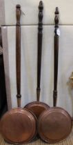 Three large 19th Century copper and brass warming pans