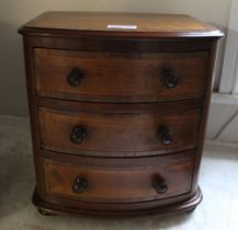 A mahogany & banded table top bow fronted set of three small drawers