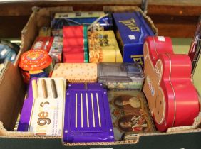 Box containing a selection of vintage tins