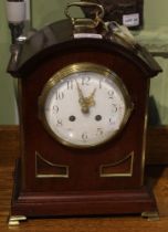 A Georgian design mahogany cased bracket clock, brass top handle and brass feet, white enamel dial w