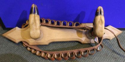 Gun / satchel hanging rack fashioned with two Roe deer slots mounted on carved oak support, together
