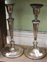 A pair of Old Sheffield plate candlesticks, of Georgian design