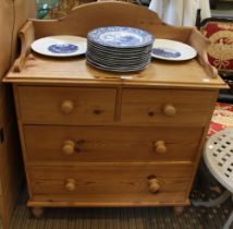 A pine chest of drawers, two short over two long