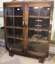 A glazed early 20th century cabinet bookcase