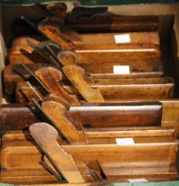 A box containing 11 Victorian moulding planes