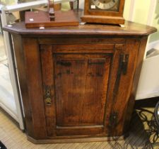 Early 19th century wall hanging corner cupboard with butterfly hinges