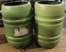 Two green garden water butts with taps