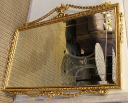 A large modern rectangular bevelled edge wall mirror with fancy gilt frame