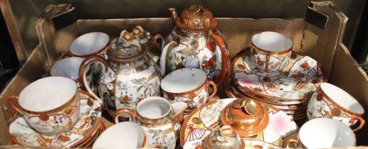 A quantity of hand painted Japanese eggshell porcelain tea ware