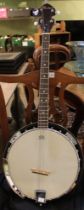 A Remo "Boston" four string banjo with case