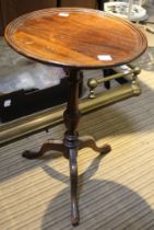 A circular wooden side table